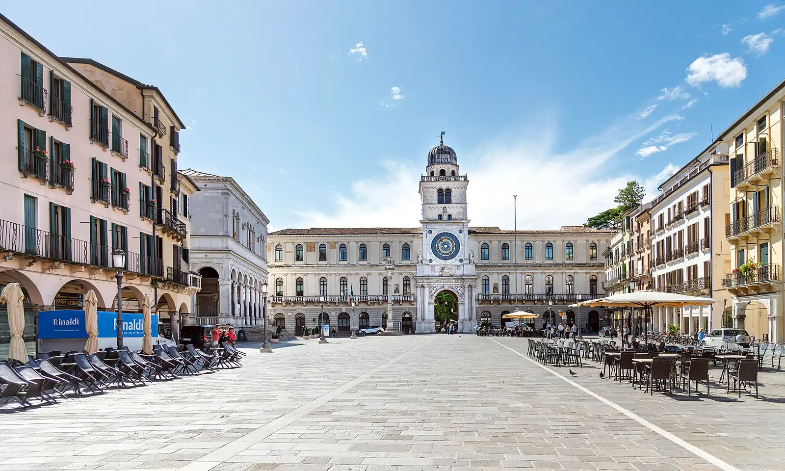 Padua neighbourhoods: loggias and the clock tower framing Piazza dei Signori, heart of the piazze core quarter