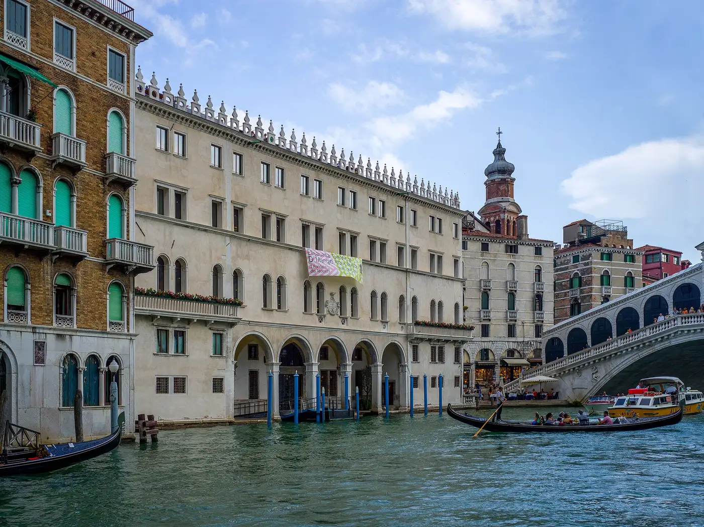 Grand Canal view from the Accademia bridge with vaporetto and gondolas — the classic first sight on a venice day trip from padua